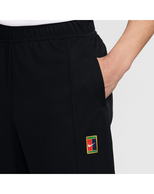 Теннисные брюки NIKE M HERITAGE SUIT PANT bk